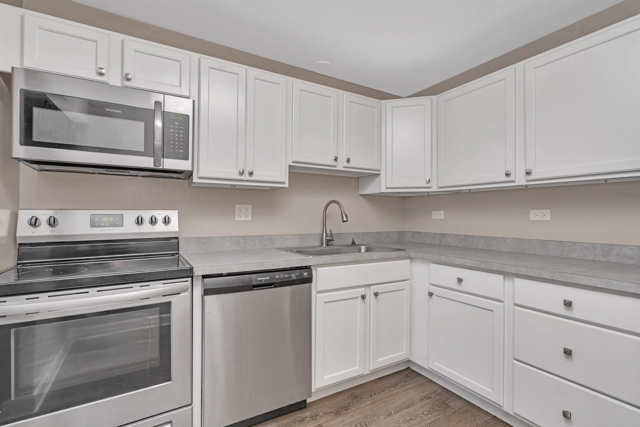 Renovated kitchen with espresso cabinetry at Lakeside Village