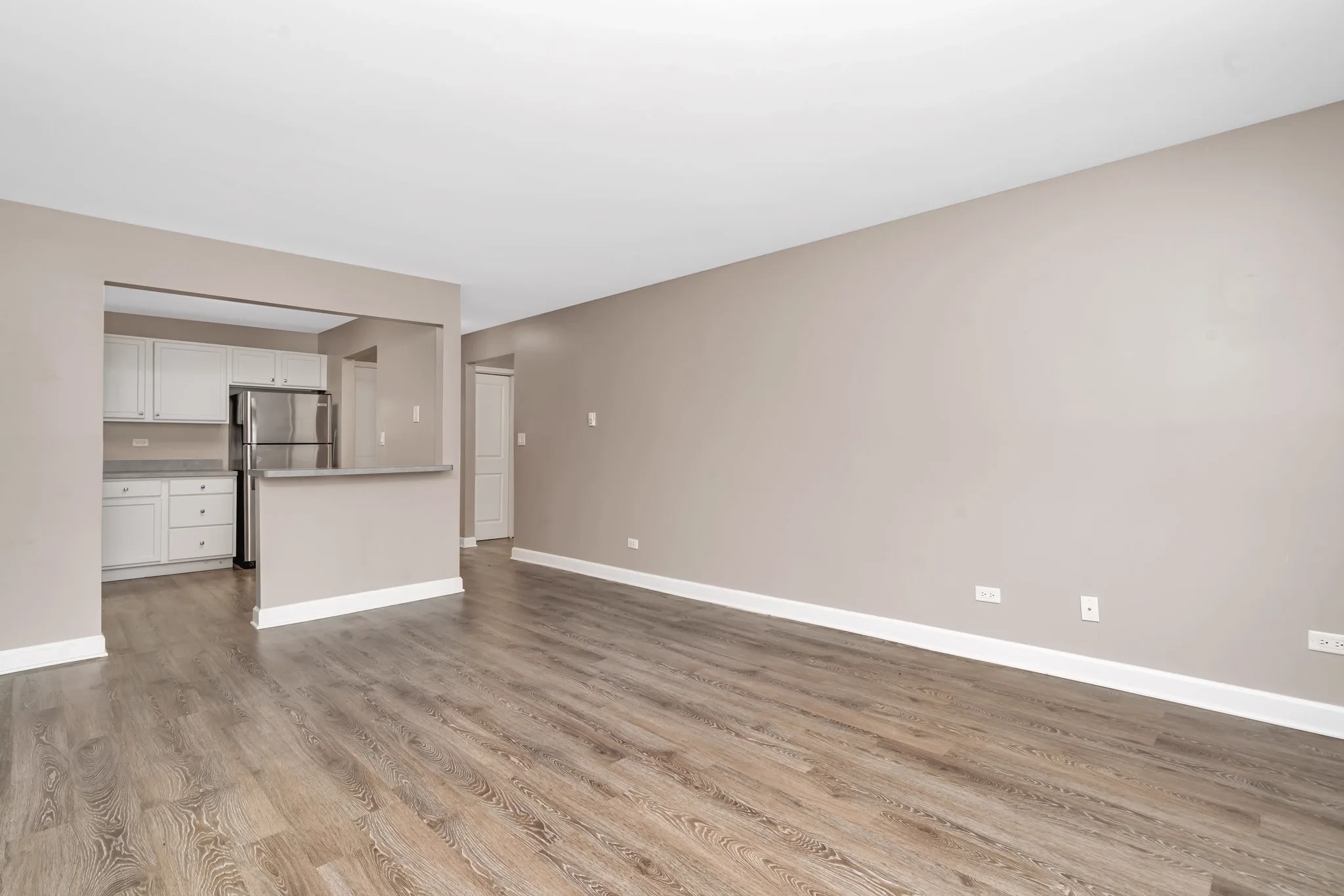 Open living room with pass-through kitchen