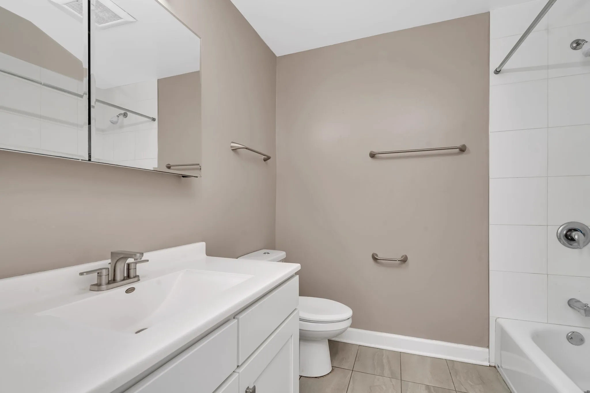 Renovated bathroom with tub and shower